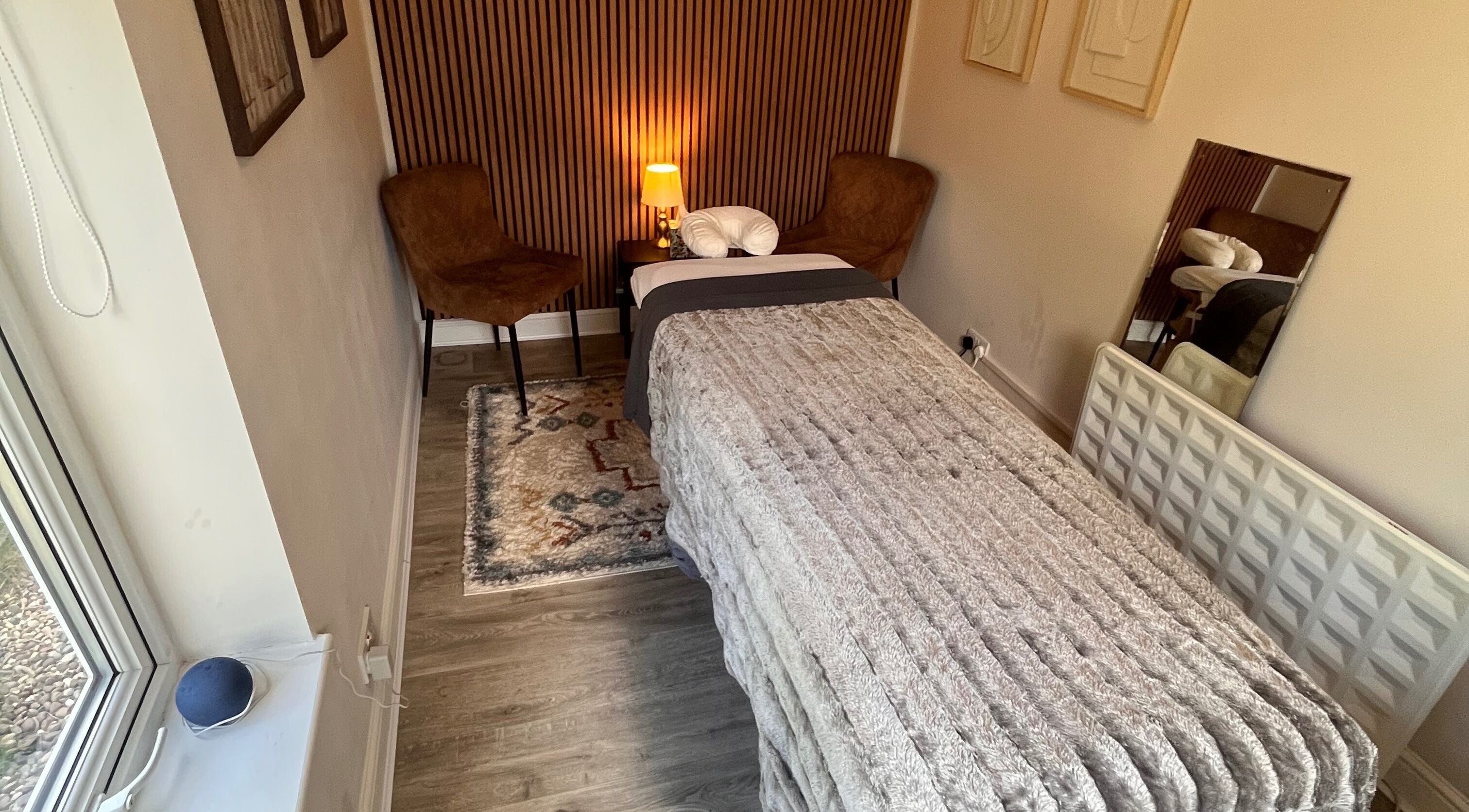 Relaxing therapy room at Woodview Holistic Therapies, Sheffield, England, GB, with a plush treatment bed.