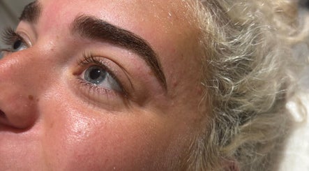Perfectly shaped eyebrows highlighted at A.M Beauty, Hinckley, England, GB for stunning enhancement.