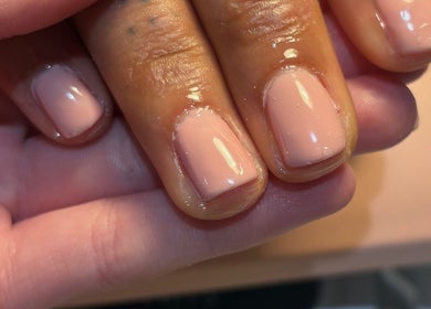Freshly polished nails in delicate pink at A.M Beauty, Hinckley, England, GB, showcasing expert nail care.