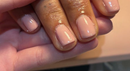 Freshly polished nails in delicate pink at A.M Beauty, Hinckley, England, GB, showcasing expert nail care.