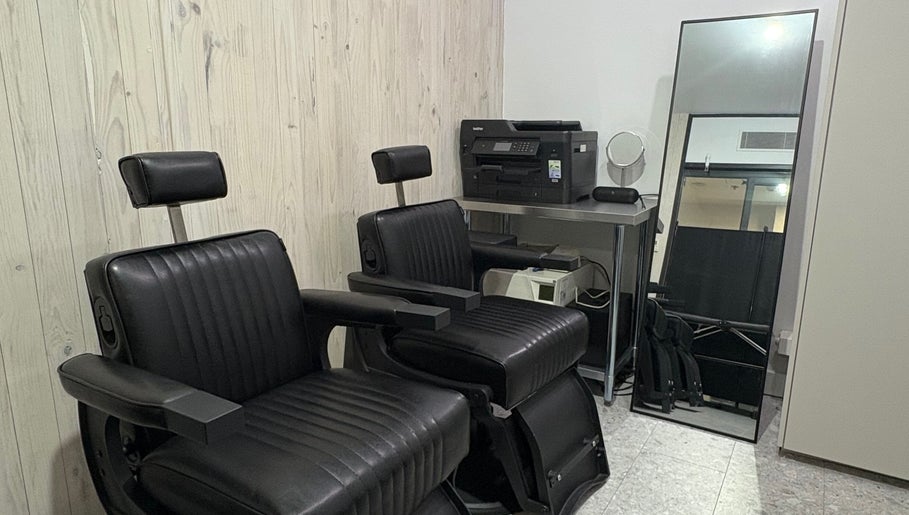 Chic black salon chairs at Ouchie, Manly, New South Wales, AU offering modern beauty services.