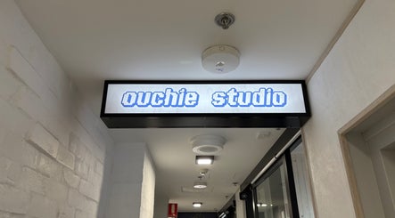 Ouchie studio entrance sign in Manly, New South Wales, AU showcases modern and inviting design.