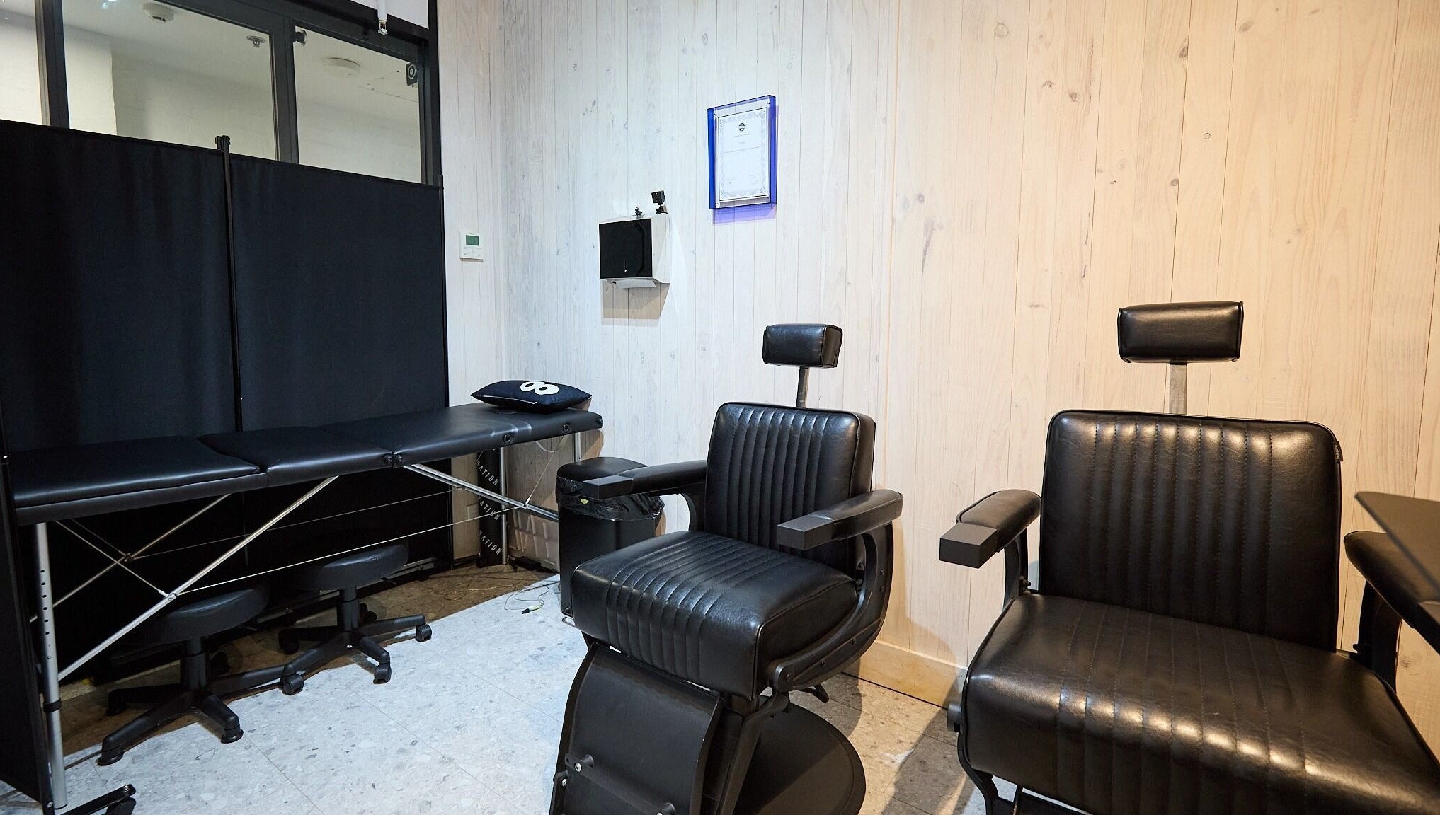 Modern salon chairs and treatment bed at Ouchie, Manly, New South Wales, AU.