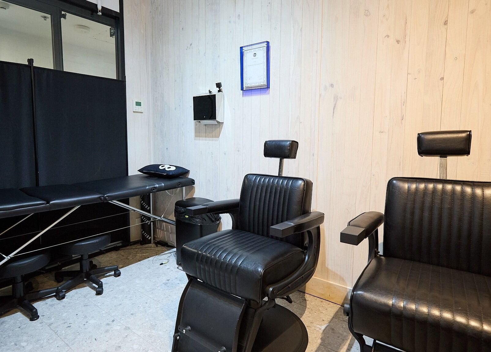 Modern salon chairs and treatment bed at Ouchie, Manly, New South Wales, AU.