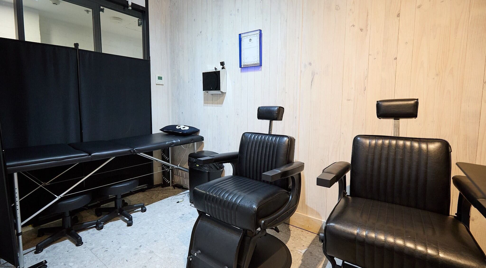 Modern salon chairs and treatment bed at Ouchie, Manly, New South Wales, AU.