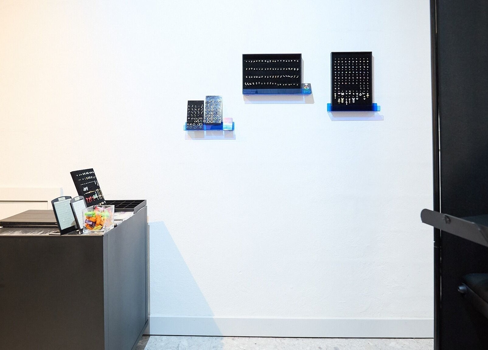 Ouchie jewelry display with wall-mounted selections in Manly, New South Wales, AU.