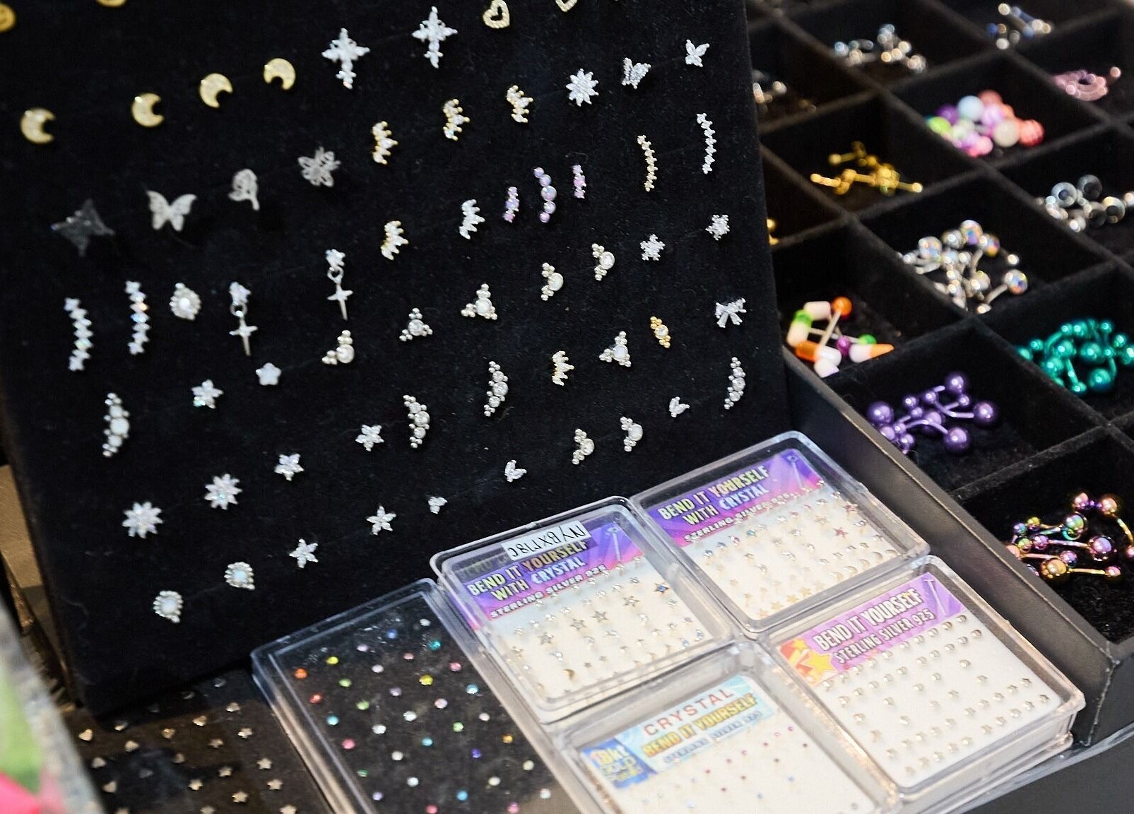 Variety of jewelry at Ouchie, Manly, New South Wales, AU, featuring earrings and decorative pieces.