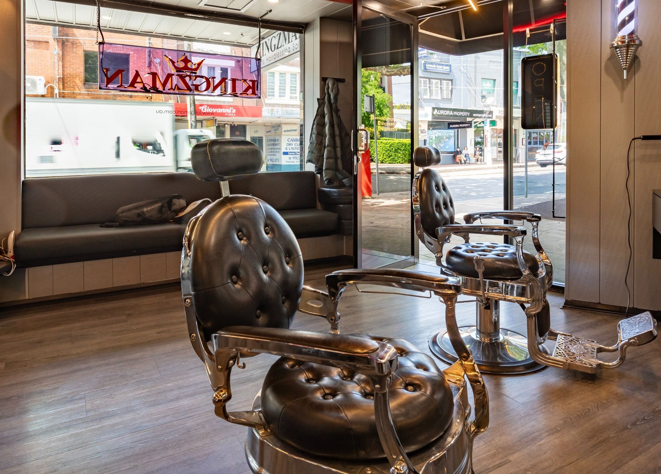 Stylish interior of KINGZMAN barbershop in Cammeray, NSW, AU with vintage chairs and modern decor.