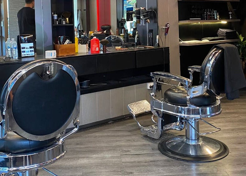 Elegant salon chairs inside KINGZMAN, Cammeray, NSW, AU, showcasing luxury and modern design.