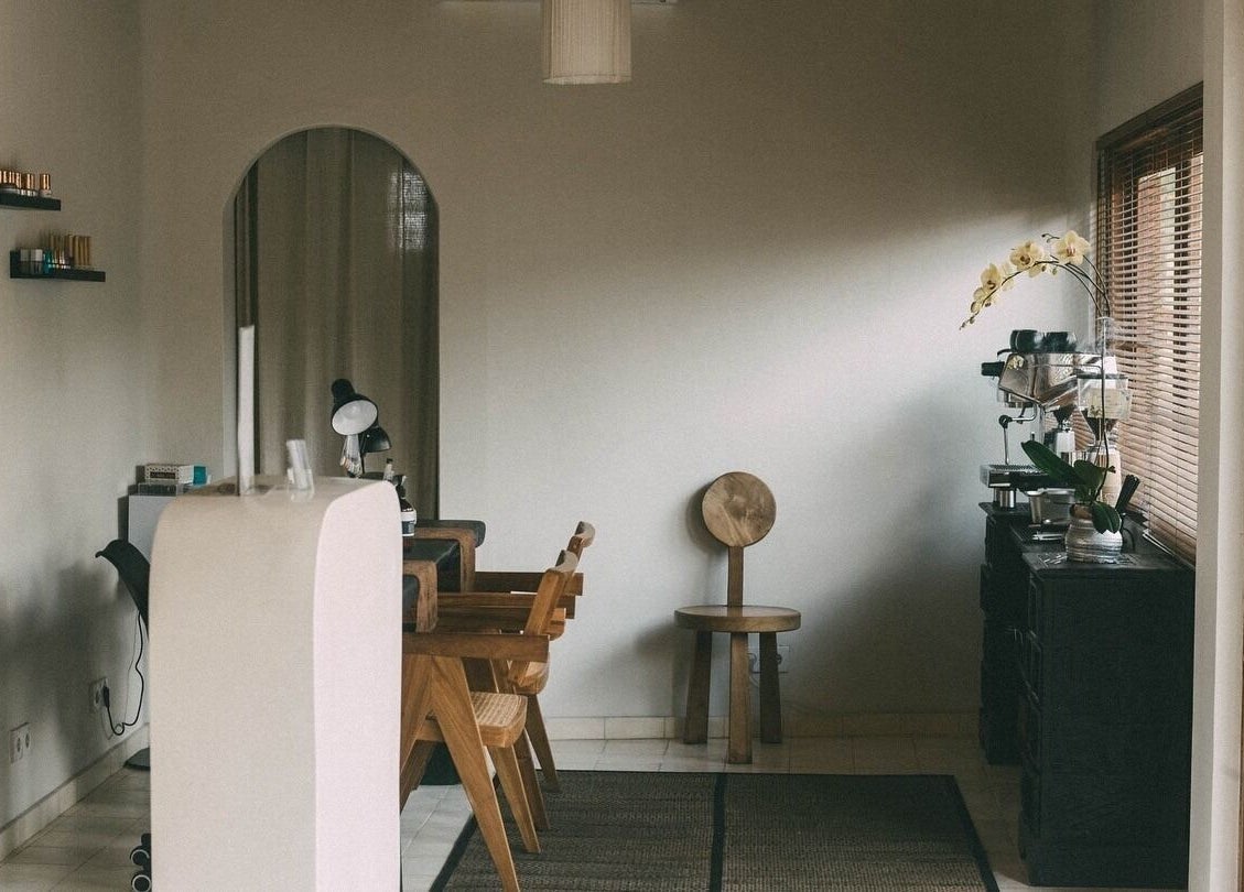 Cozy interior of Studio SAMĀ Nails & Coffee [Nyuh Kuning], Bali, Bali, ID with wooden furniture and soft lighting.