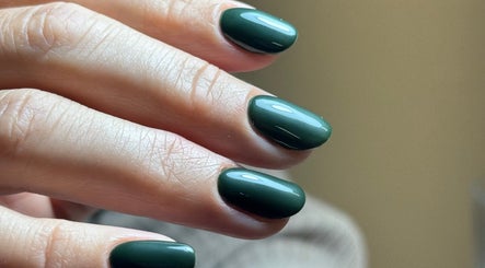 Elegant green manicure at B By Sam, Carlisle, England, GB. Glossy emerald nails showcase meticulous artistry.