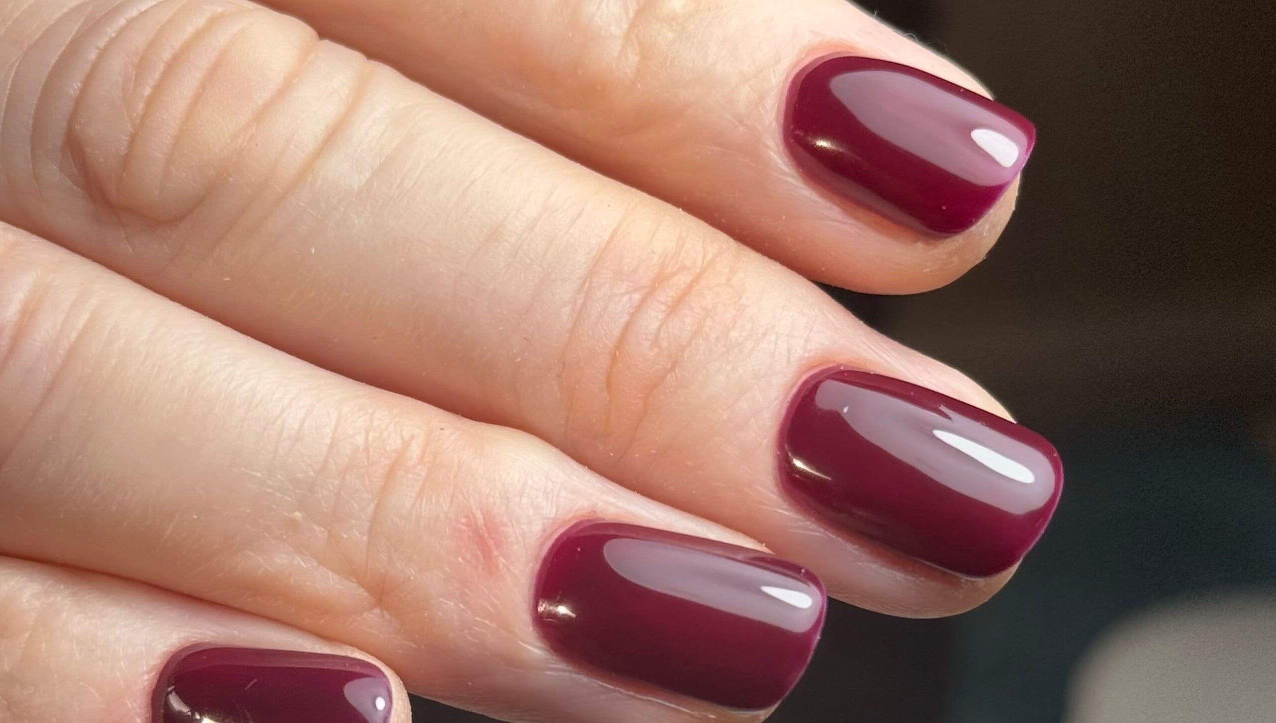 Crimson manicure at B By Sam, Carlisle, England, GB. Expertly done nail art for ultimate beauty.