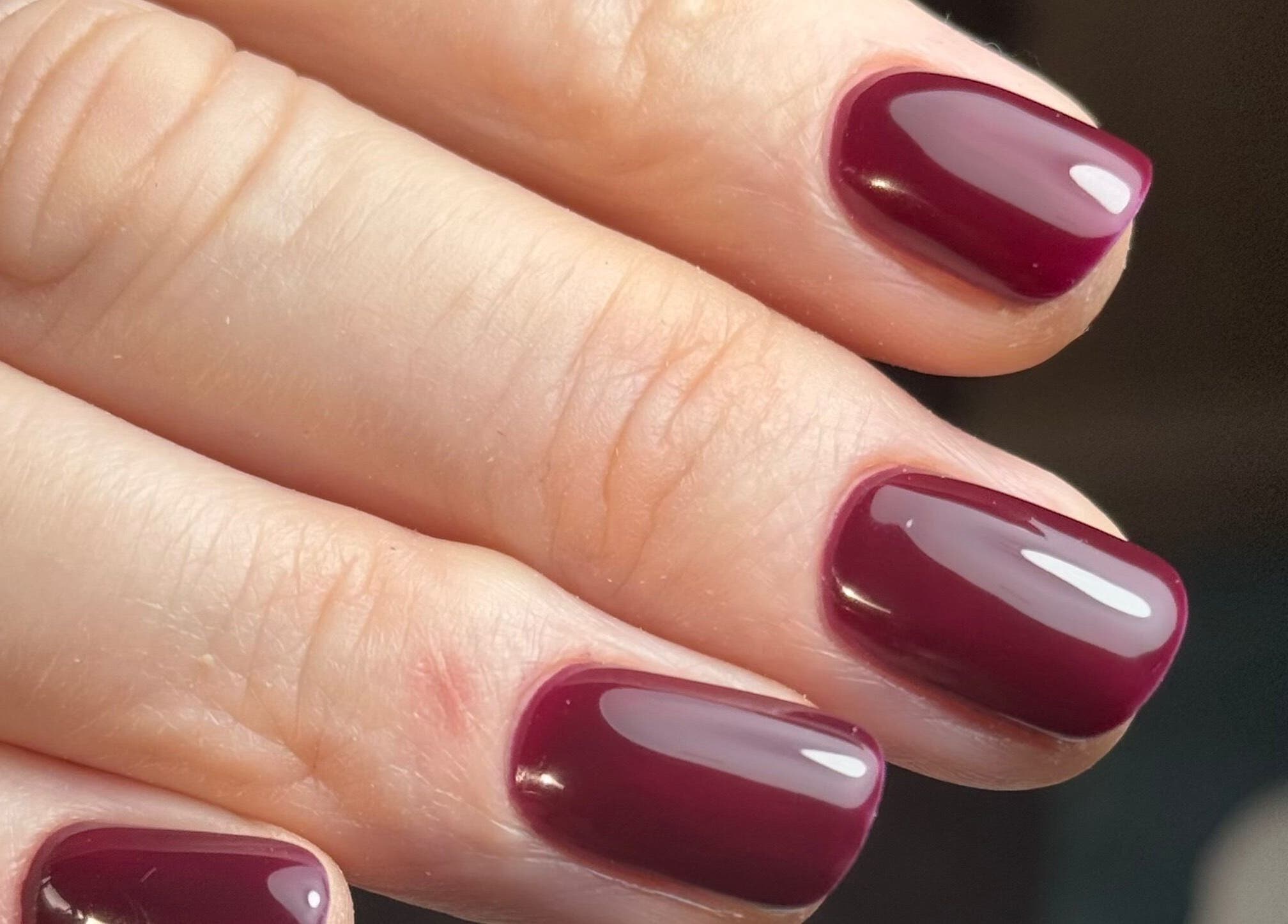 Crimson manicure at B By Sam, Carlisle, England, GB. Expertly done nail art for ultimate beauty.