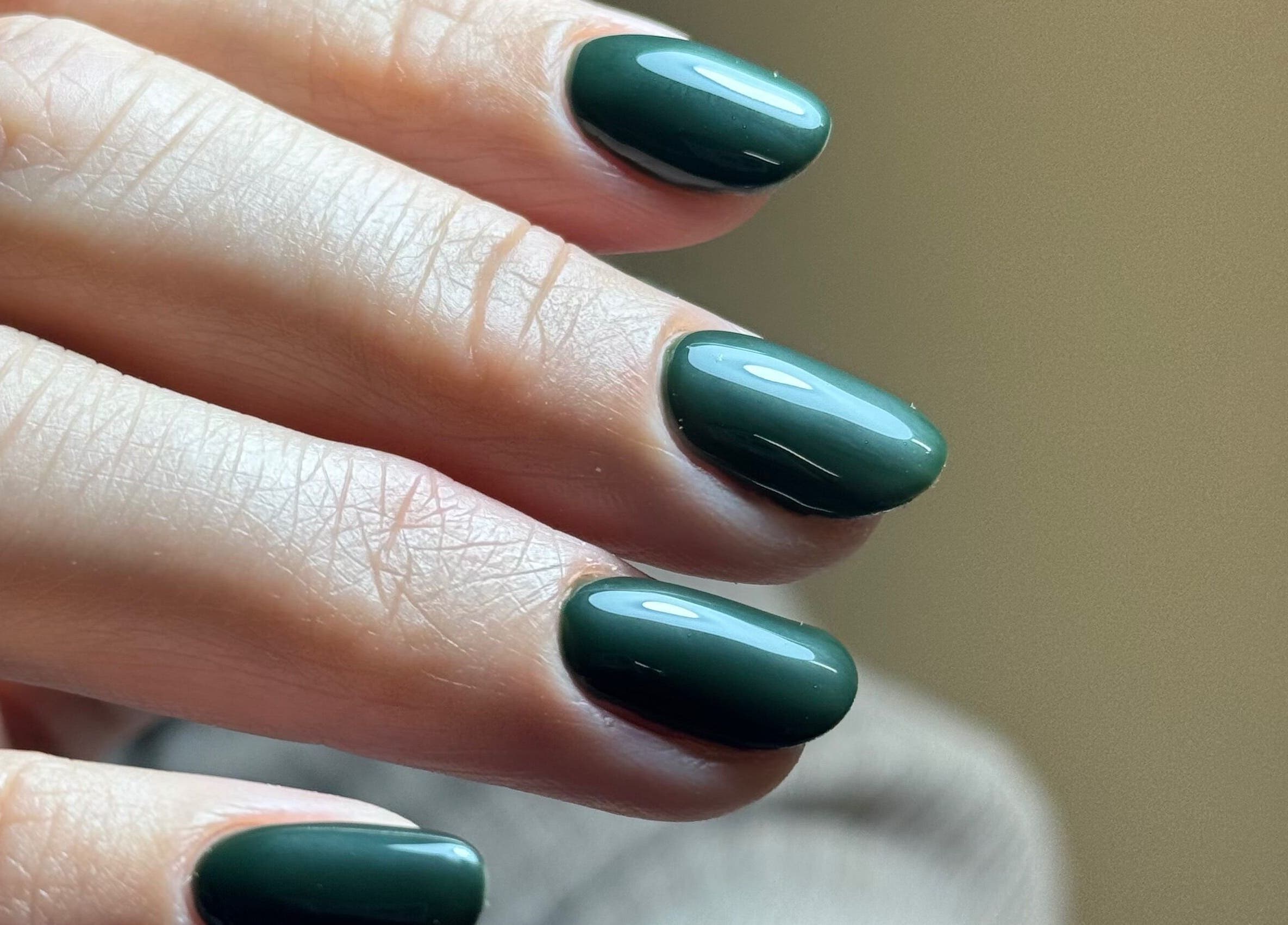 Elegant green manicure at B By Sam in Carlisle, England, GB, showcasing glossy nail finish.