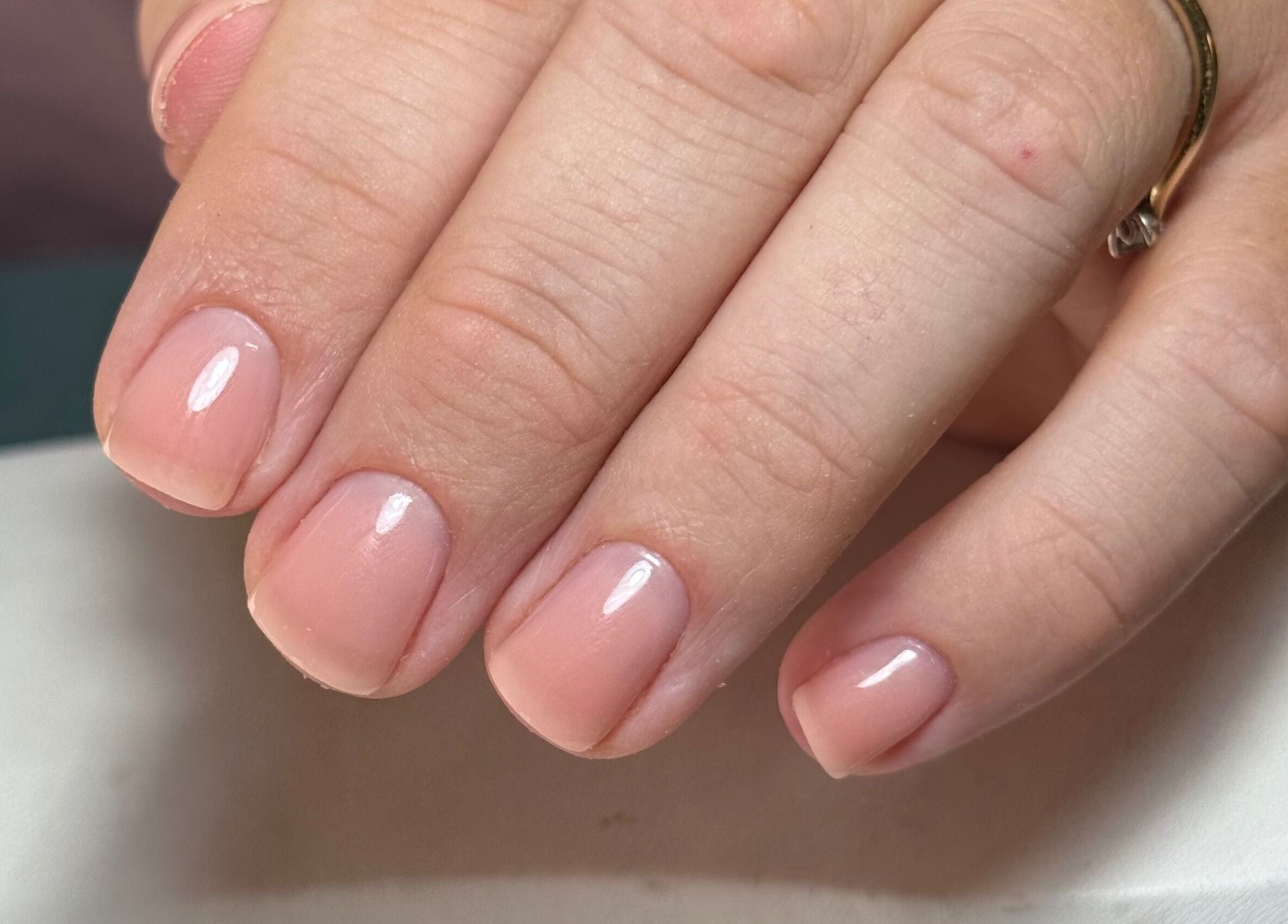 Elegant nude manicure at B By Sam, Carlisle, England, GB showcasing glossy finish.