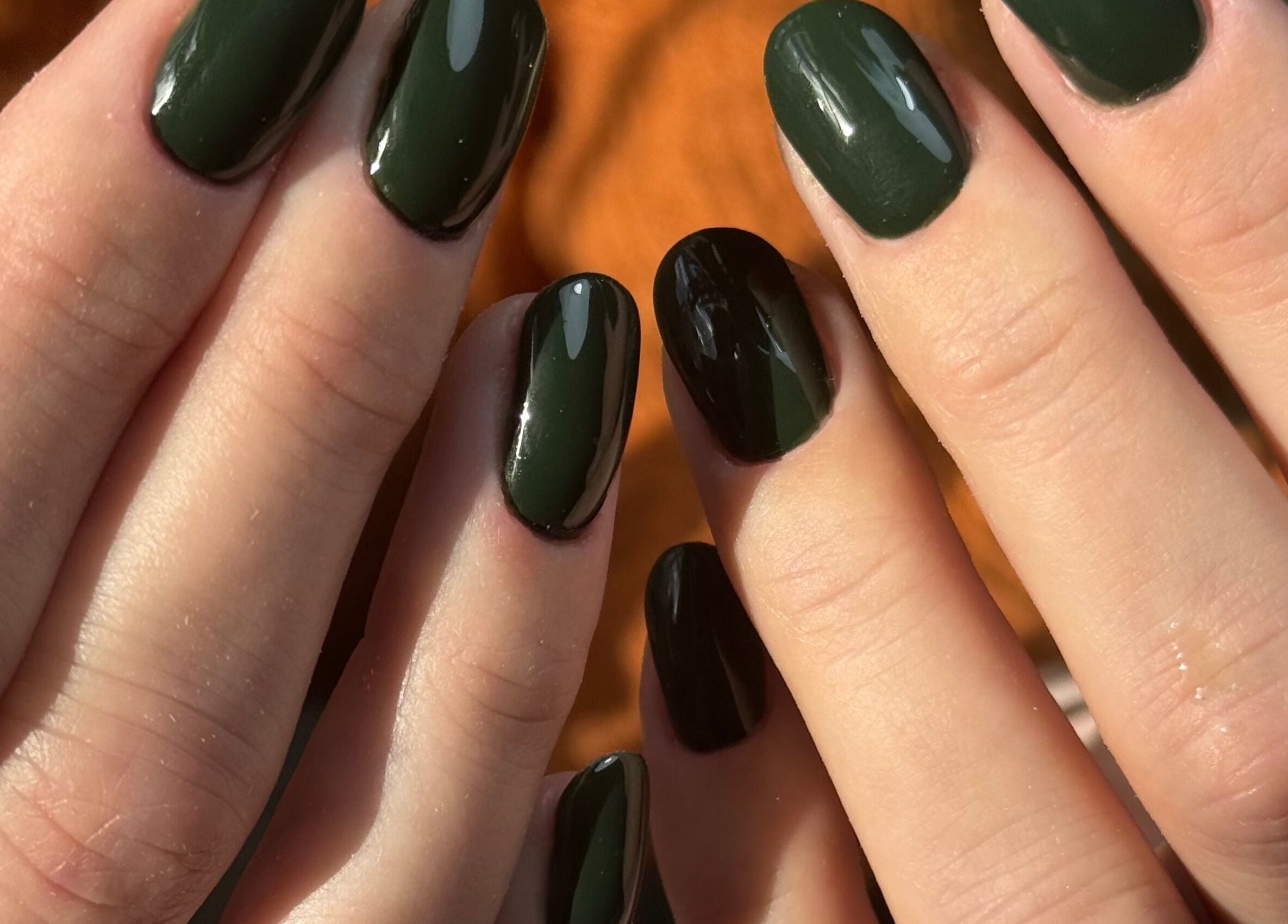 Forest green manicured nails at B By Sam, Carlisle, England, GB, showcasing glossy finish and professional care.