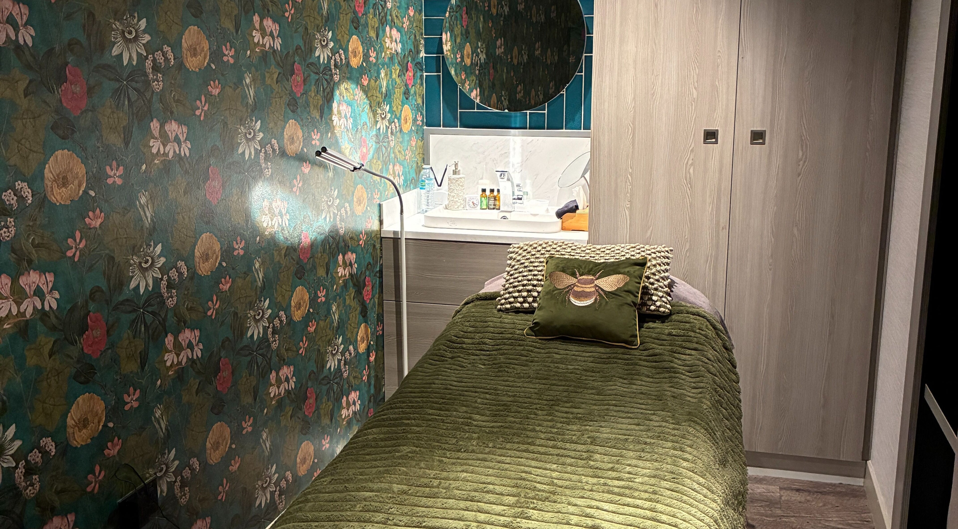 Serene treatment room at Reflexology Wimbledon, Gina Conway Salon and Spa, London, England, GB, with nature-themed decor.