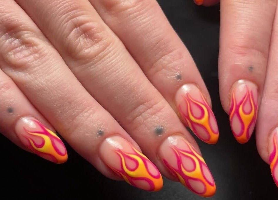 Fiery nail art at Lady Luck Nails Worthing, West Sussex, GB. Intricate flame design on natural nails.