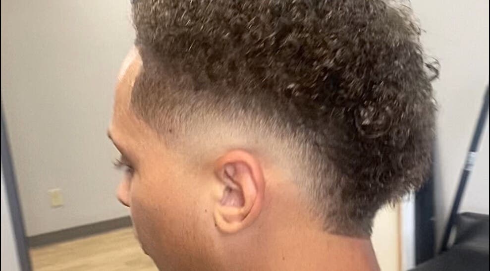 Fresh haircut with a stylish fade at Jesus in da Cut ™️, Berrien Springs, Michigan, US.