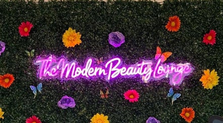 Vibrant floral wall with 'The Modern Beauty Lounge, LLC' neon sign in Inman, South Carolina, US.