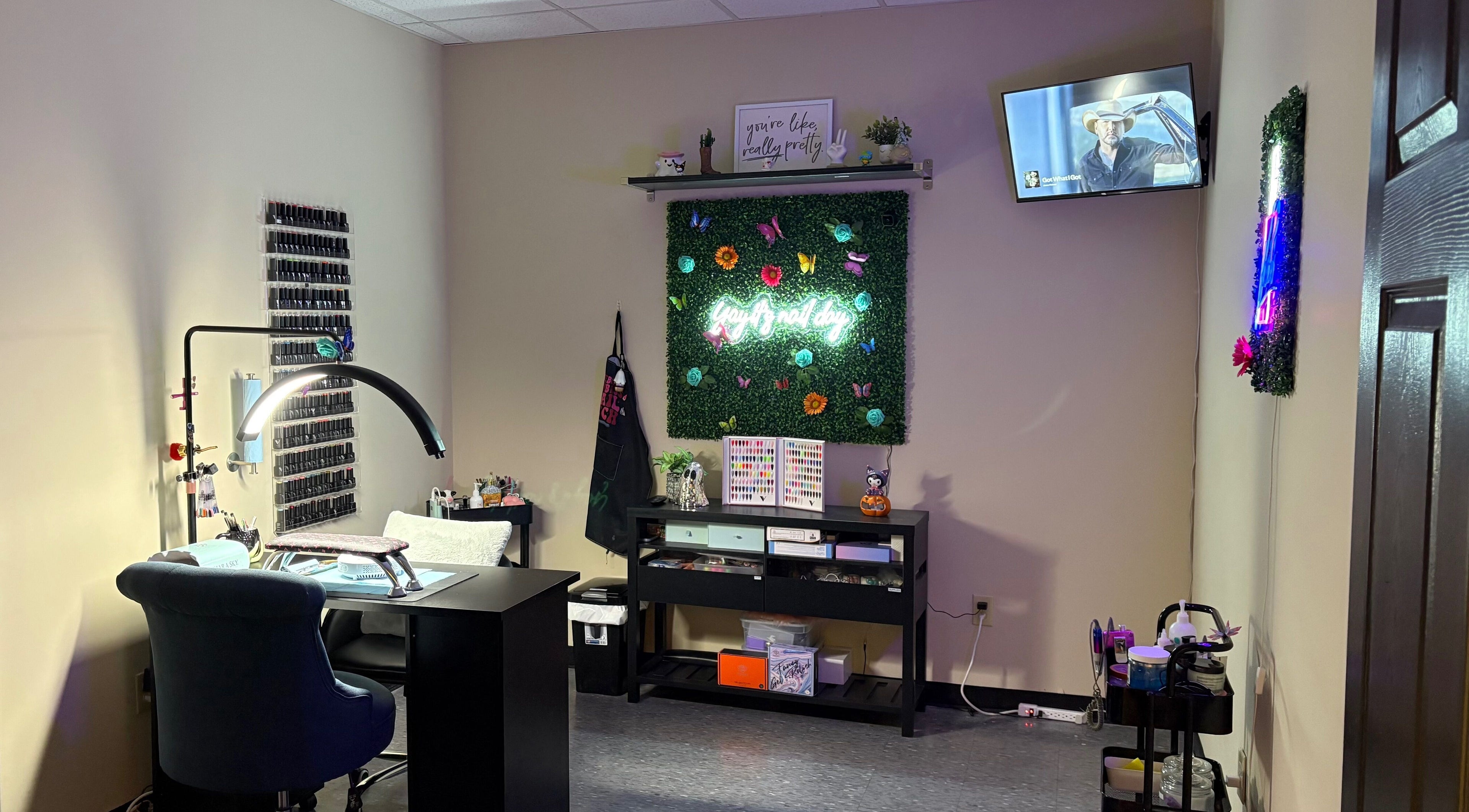 Nail station at The Modern Beauty Lounge, LLC, Inman, South Carolina, US, with decor and seating.