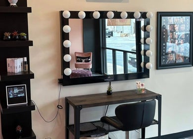 Elegant beauty station at The Modern Beauty Lounge, LLC in Inman, South Carolina, US with mirror lights.
