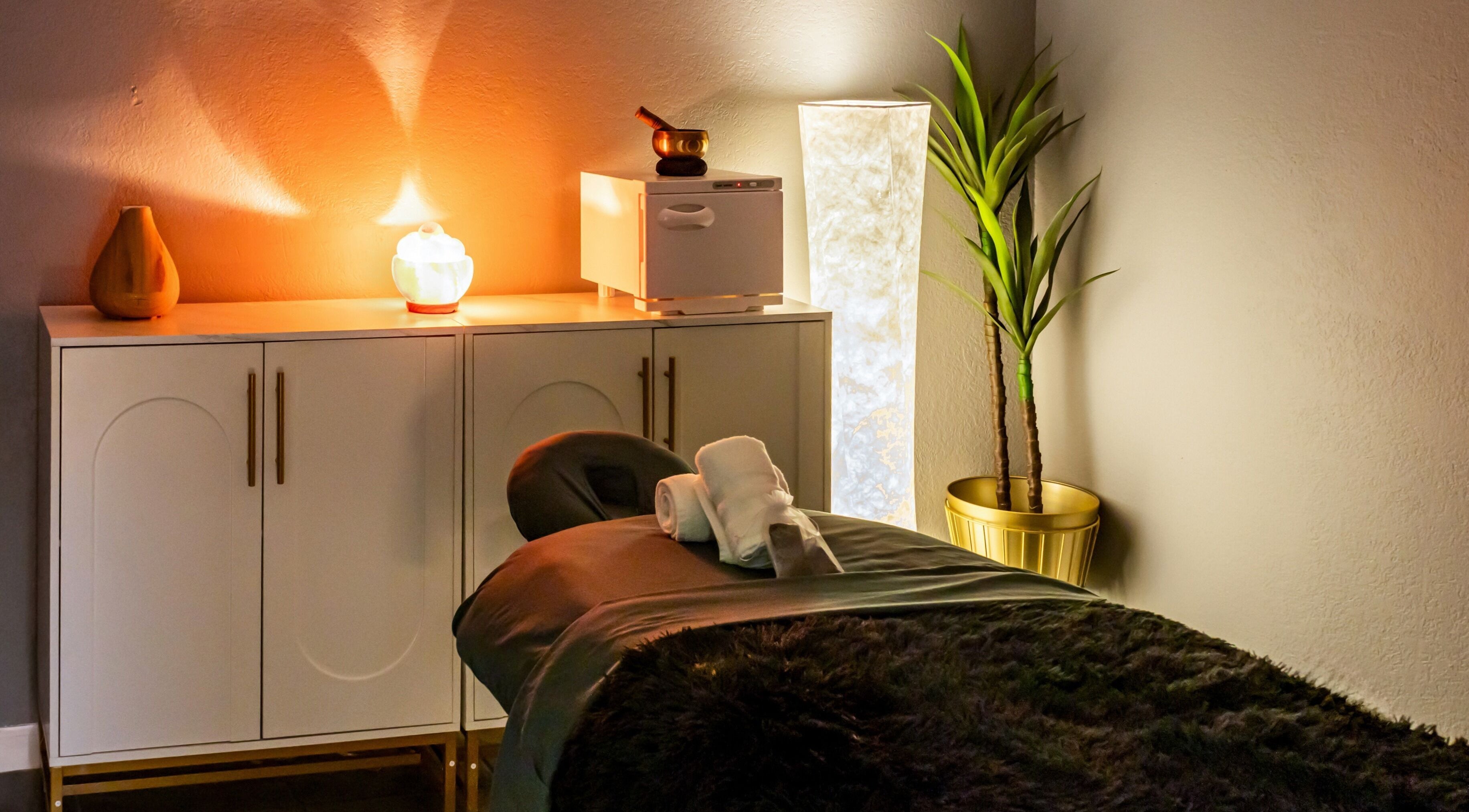 Relaxing massage room at The Shape Spa (Ft. Lauderdale), Fort Lauderdale, Florida, US with ambient lighting.