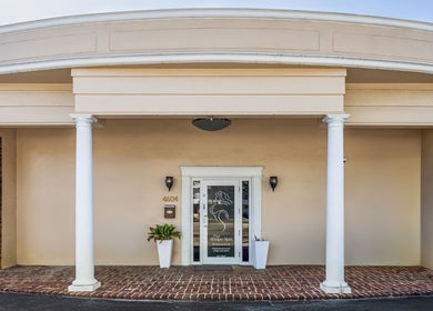 The entrance of The Shape Spa (Ft. Lauderdale) in Fort Lauderdale, Florida, US features classic columns.