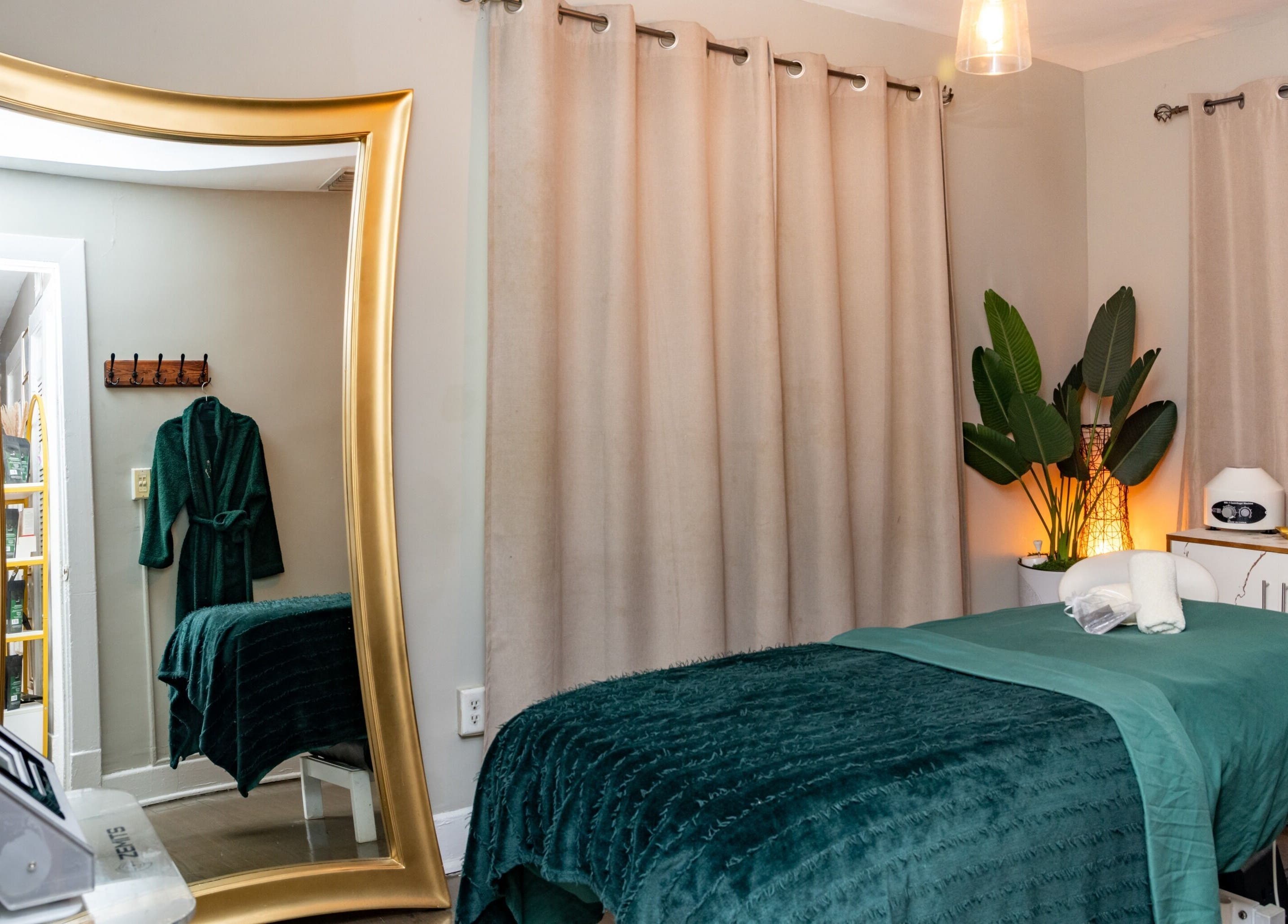 Luxurious treatment room at The Shape Spa in Miami Beach, Florida featuring a plush bed and elegant decor.
