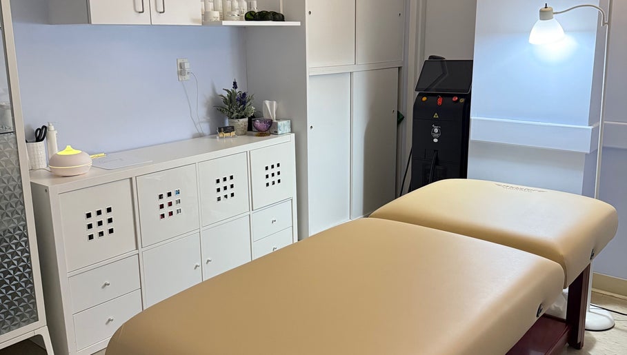 Calming treatment room at Laser & Skincare by Yana Koval, Moncton, Canada, CA featuring a massage table.