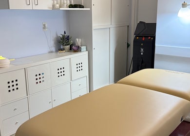 Calming treatment room at Laser & Skincare by Yana Koval, Moncton, Canada, CA featuring a massage table.