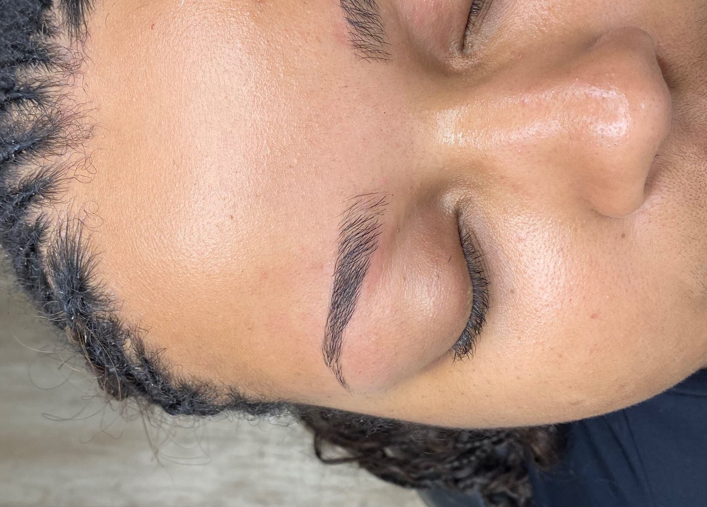 Close-up of freshly shaped eyebrows at SkinDeep, Nassau, New Providence, BS. A professional beauty treatment.