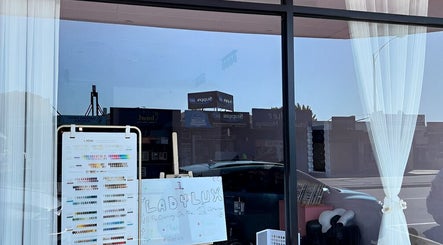 Window display of Ladylux de Beaute in Melbourne, Victoria, AU, featuring enticing beauty services.