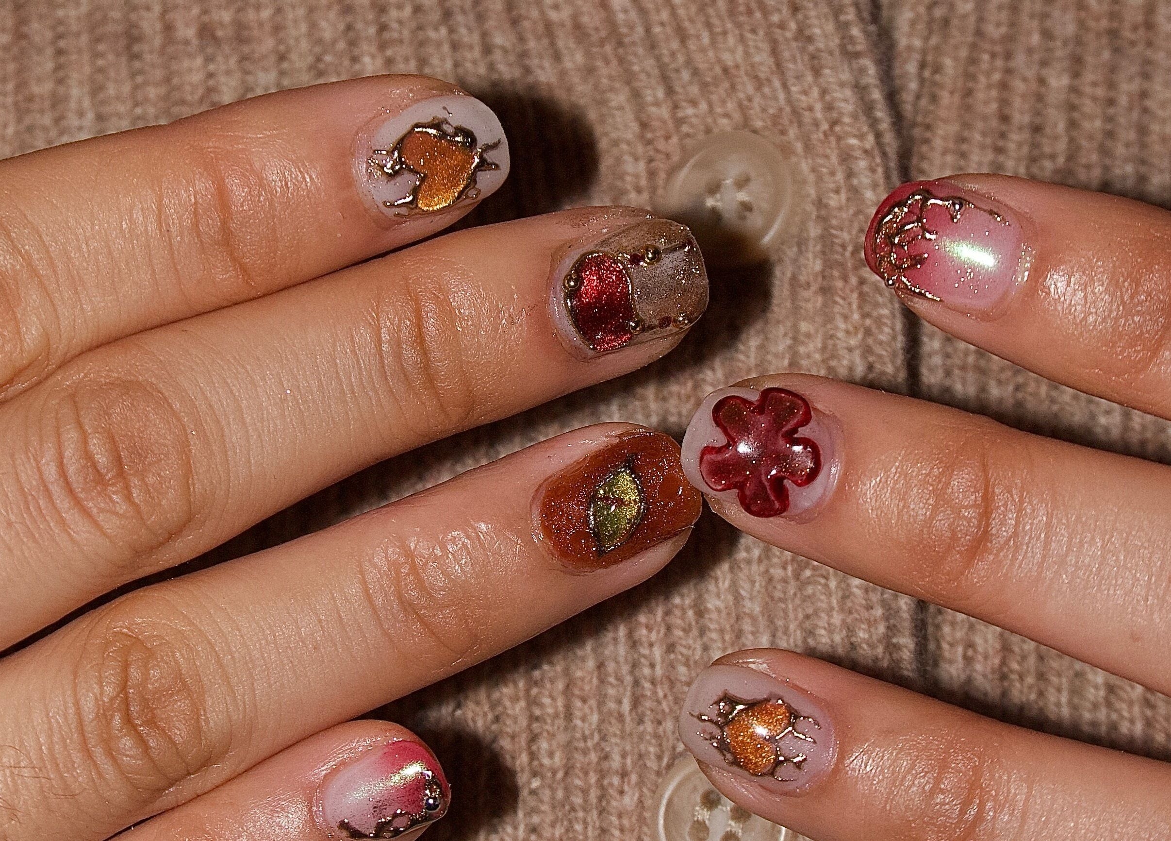 Unique nail art design at Ladylux de Beaute, Melbourne, Victoria, AU, featuring intricate colorful patterns.