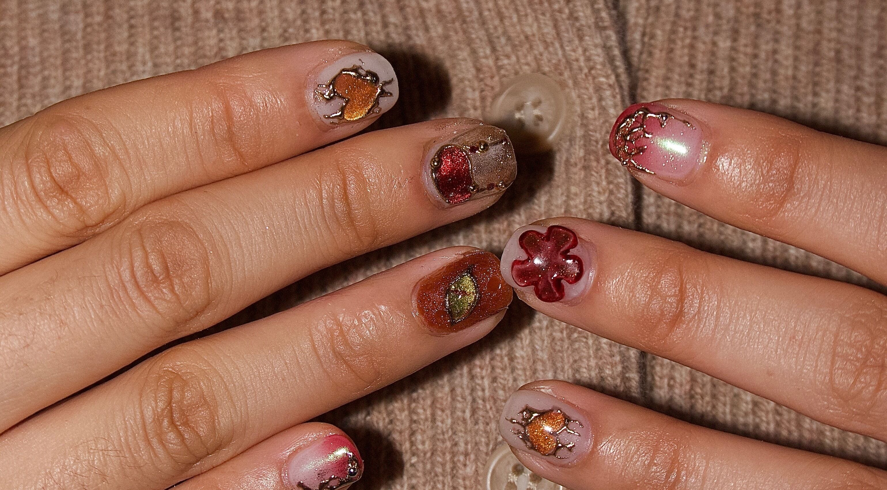 Unique nail art design at Ladylux de Beaute, Melbourne, Victoria, AU, featuring intricate colorful patterns.