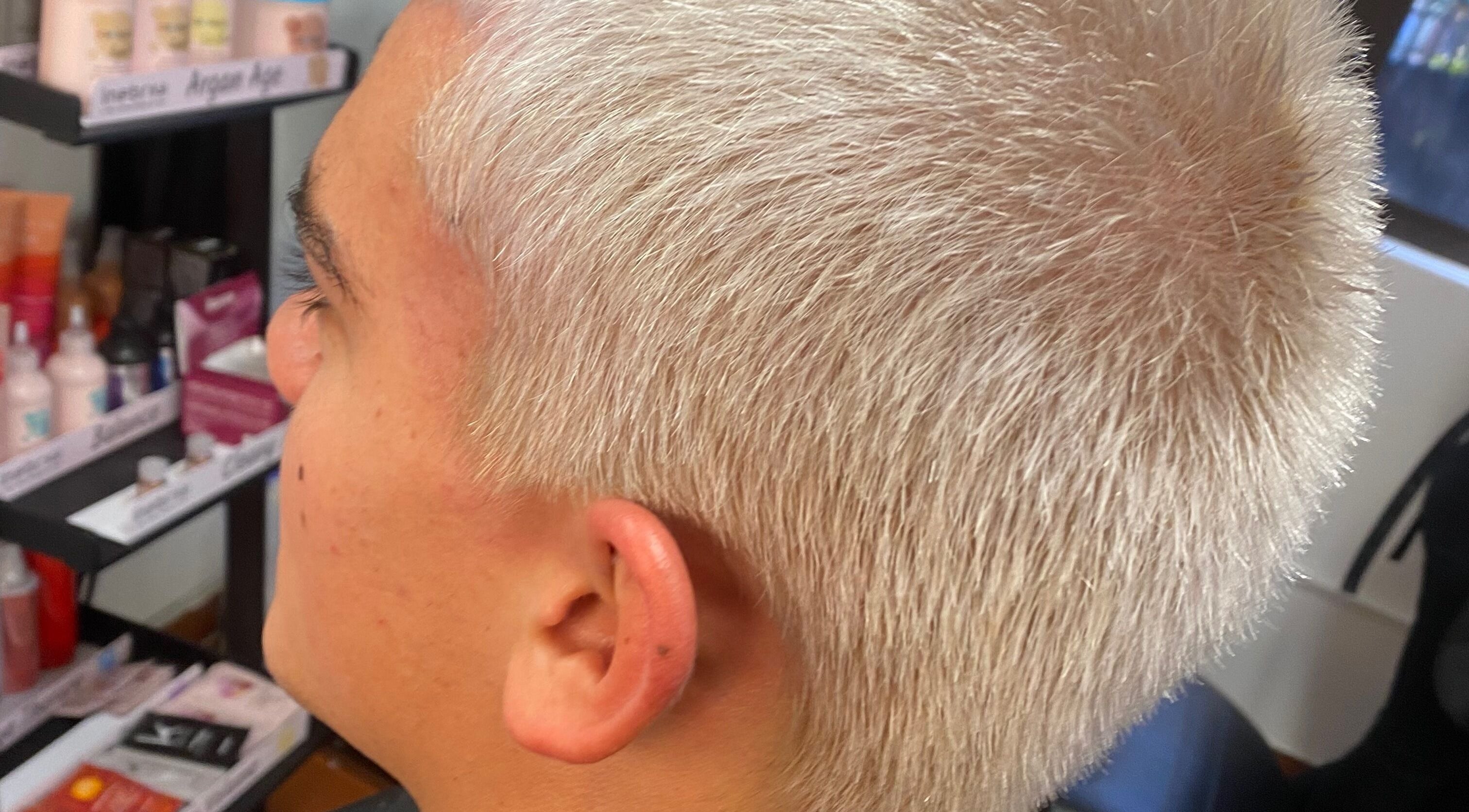 Close-up of platinum-blonde haircut at Hair Trendz by Crystal, Ballito, Kwazulu-natal, ZA. Modern and chic salon styling.