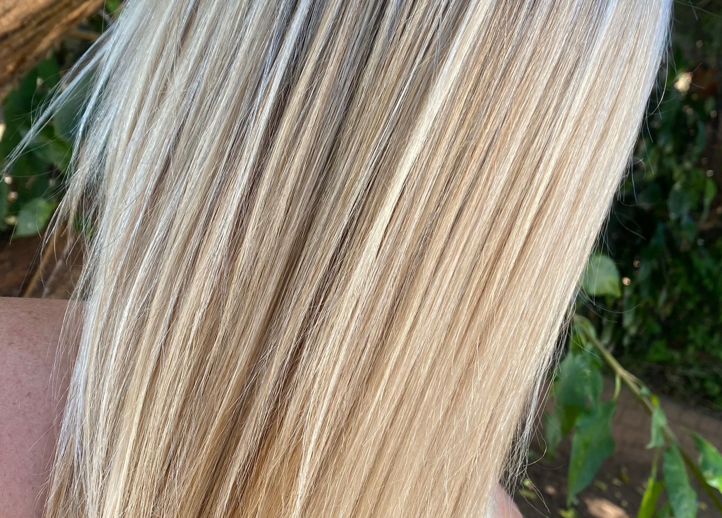 Silky blonde hair flowing beautifully at Hair Trendz by Crystal in Ballito, Kwazulu-natal, ZA.
