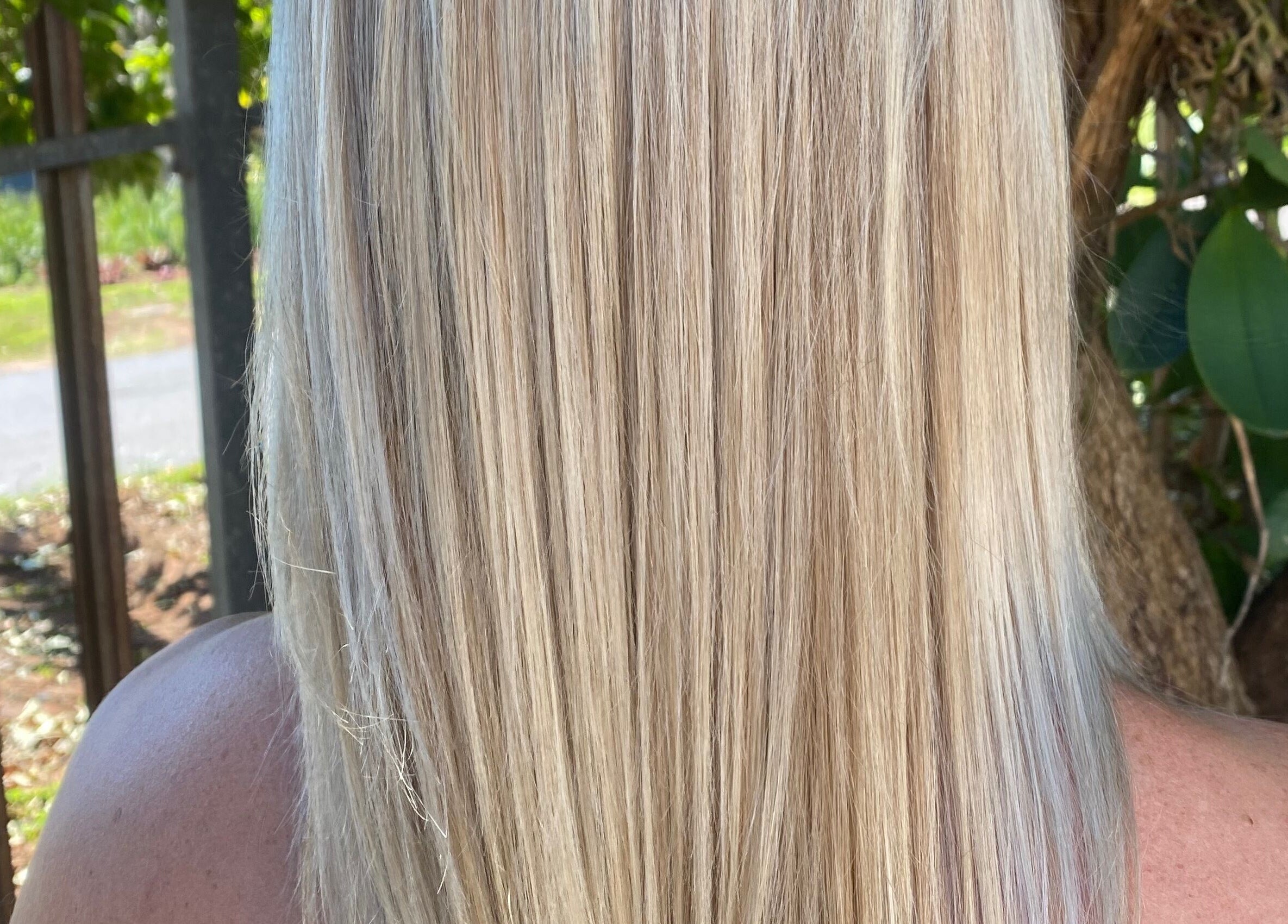 Blonde straight hair styled at Hair Trendz by Crystal in Ballito, Kwazulu-natal, ZA, showcasing natural beauty.