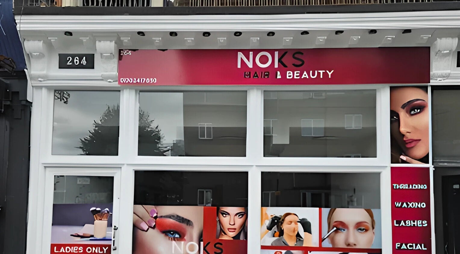 Front view of Noks Hair and Beauty salon in Southend-on-sea, England, showcasing vibrant signage and inviting entrance.