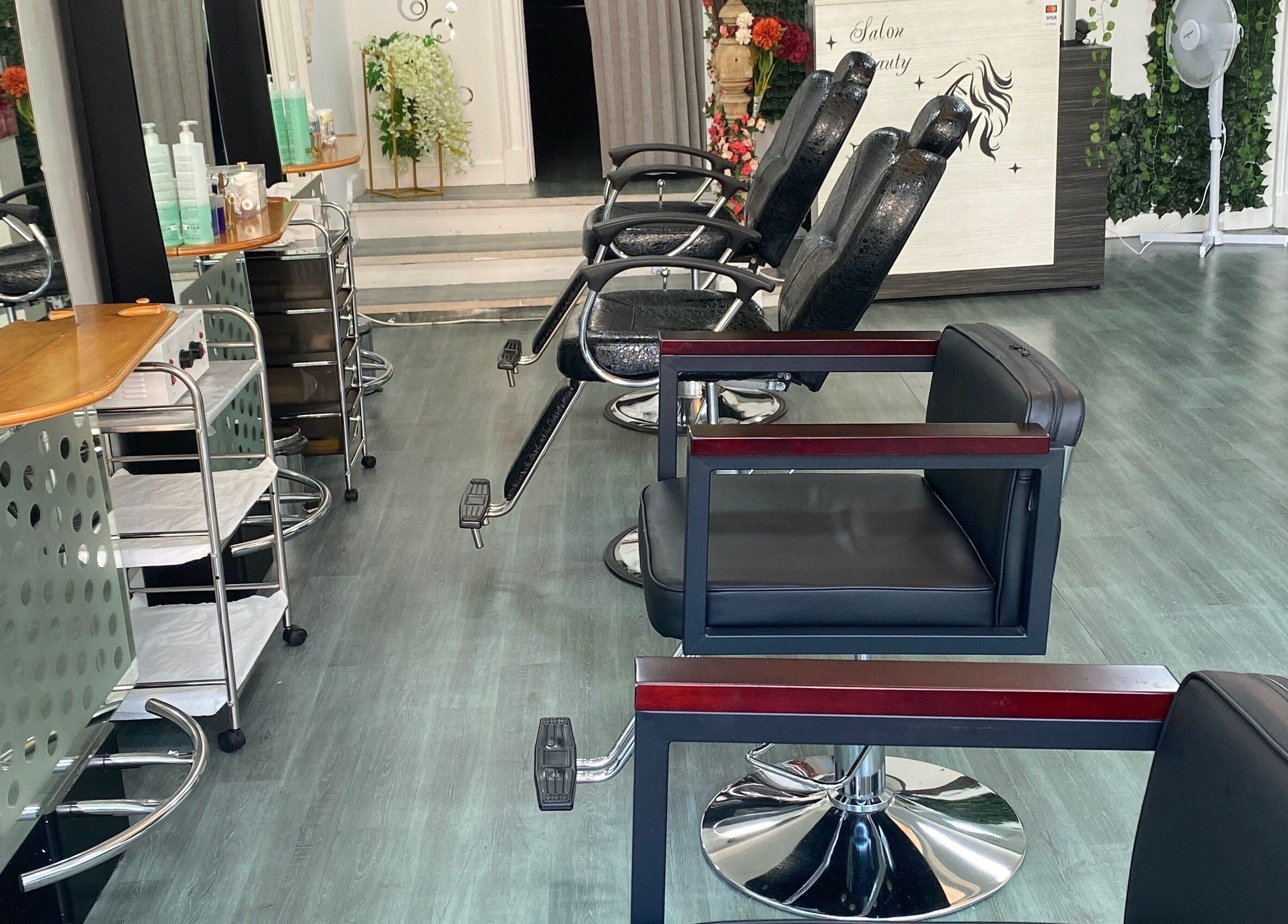 Modern interior of 264 London road Westcliff-On-Sea salon, Southend-on-sea, England, GB with sleek black chairs.