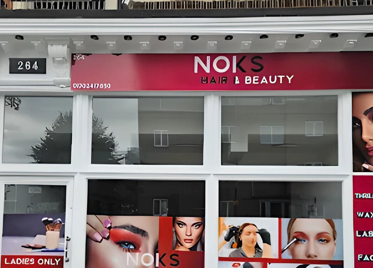 Exterior of Noks Hair and Beauty in Southend-on-sea, England, GB, highlighting salon services and vibrant branding.