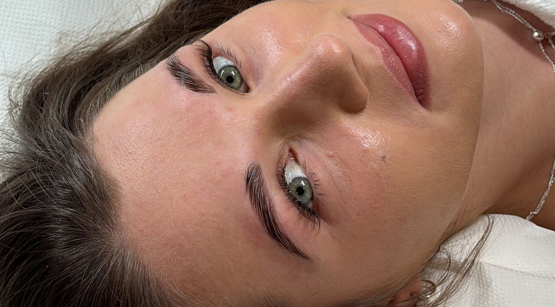 Close-up of a client's glowing skin after treatment at Aiia Clinic in London, England, GB.