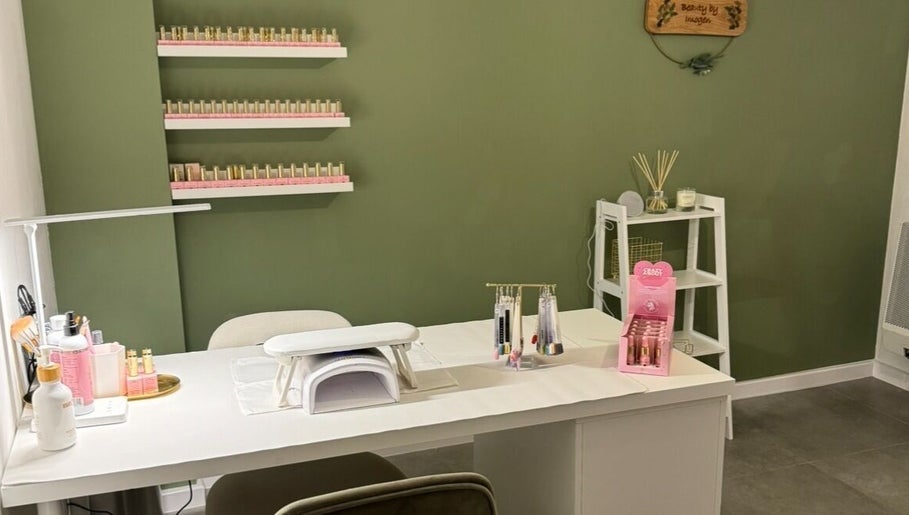 Modern nail station at Beauty By Imogen in Oxspring, England, GB with elegant decor and ample nail polish display.
