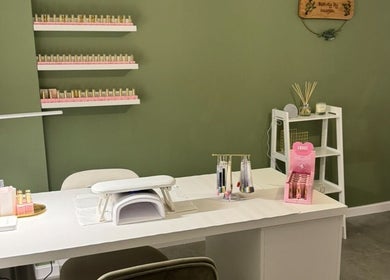 Modern nail station at Beauty By Imogen in Oxspring, England, GB with elegant decor and ample nail polish display.