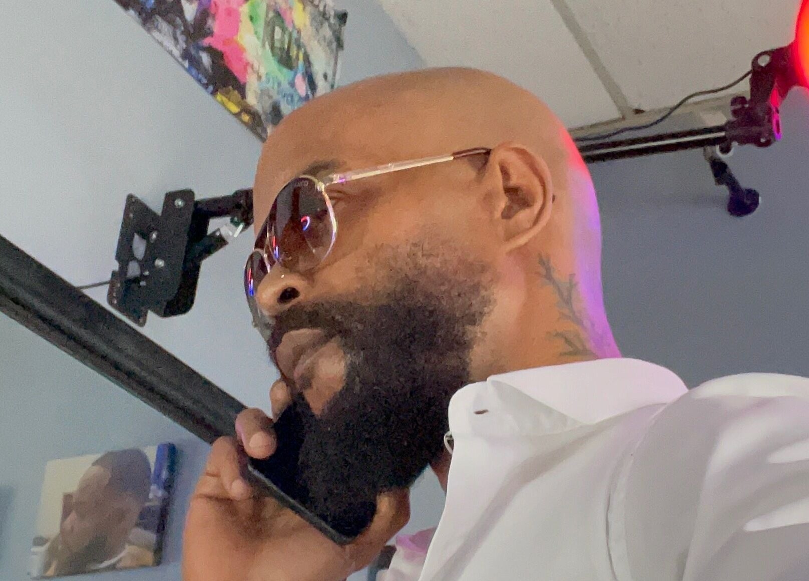 Man with sunglasses at Christofer Styles Grooming LLC, College Park, Georgia, US, showcasing modern style.