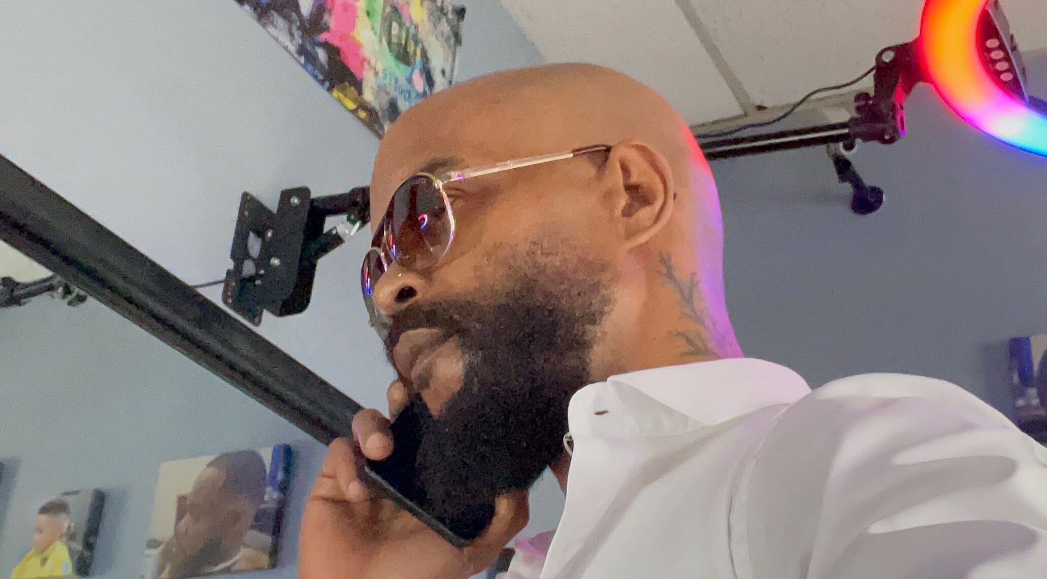 Man with sunglasses at Christofer Styles Grooming LLC, College Park, Georgia, US, showcasing modern style.