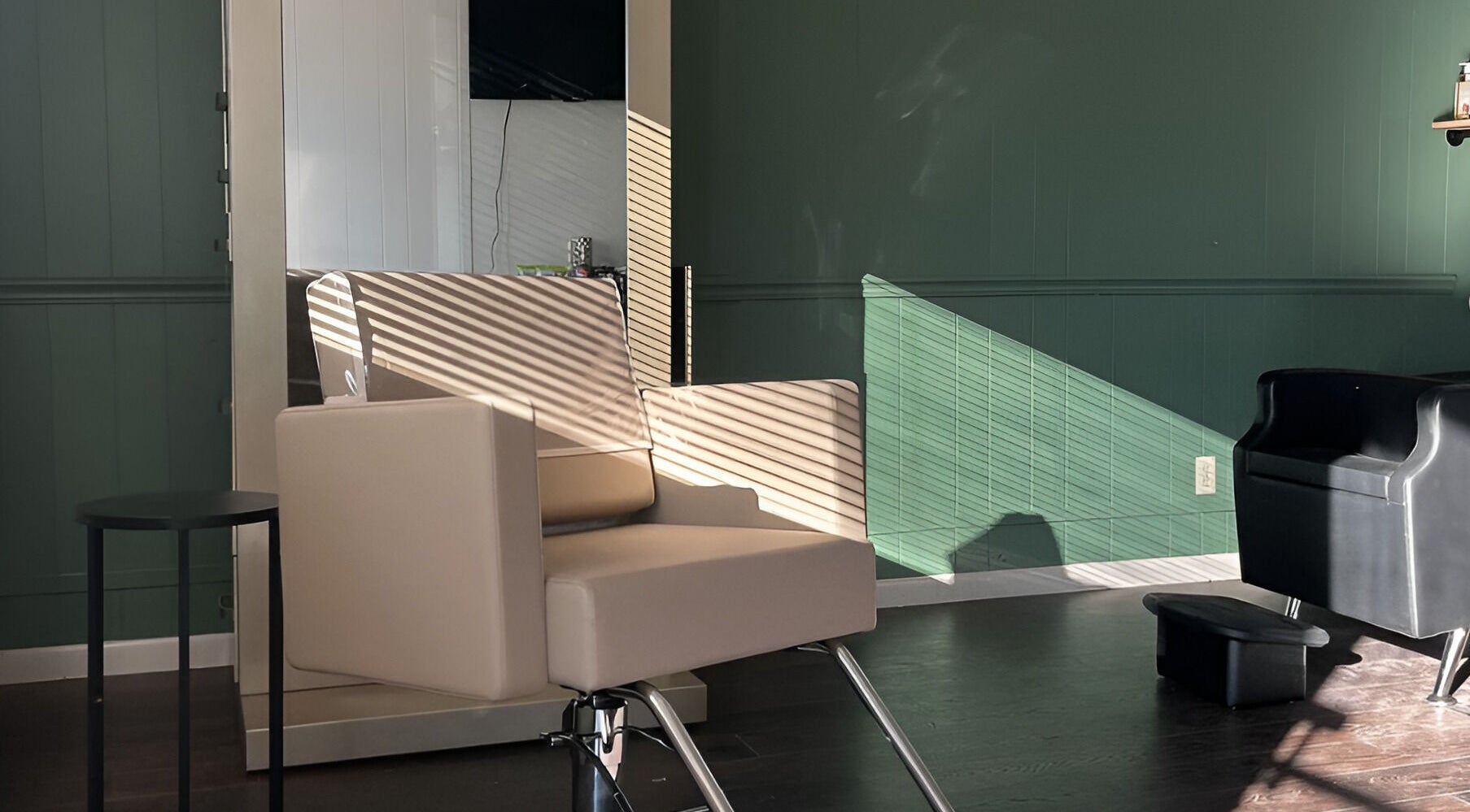 Modern salon chair in Eagle Lounge, Brookfield, Missouri, US, illuminated by soft natural light.