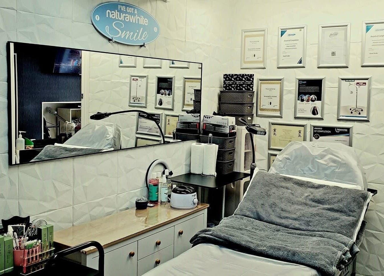 Chloe Louise treatment room with certificates, Otley, England, GB highlighting comfort and professionalism.