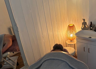 Massage room at Holistics by Moon Sparkles & Wood, Walkern, England, GB, featuring a cozy ambiance and soft lighting.