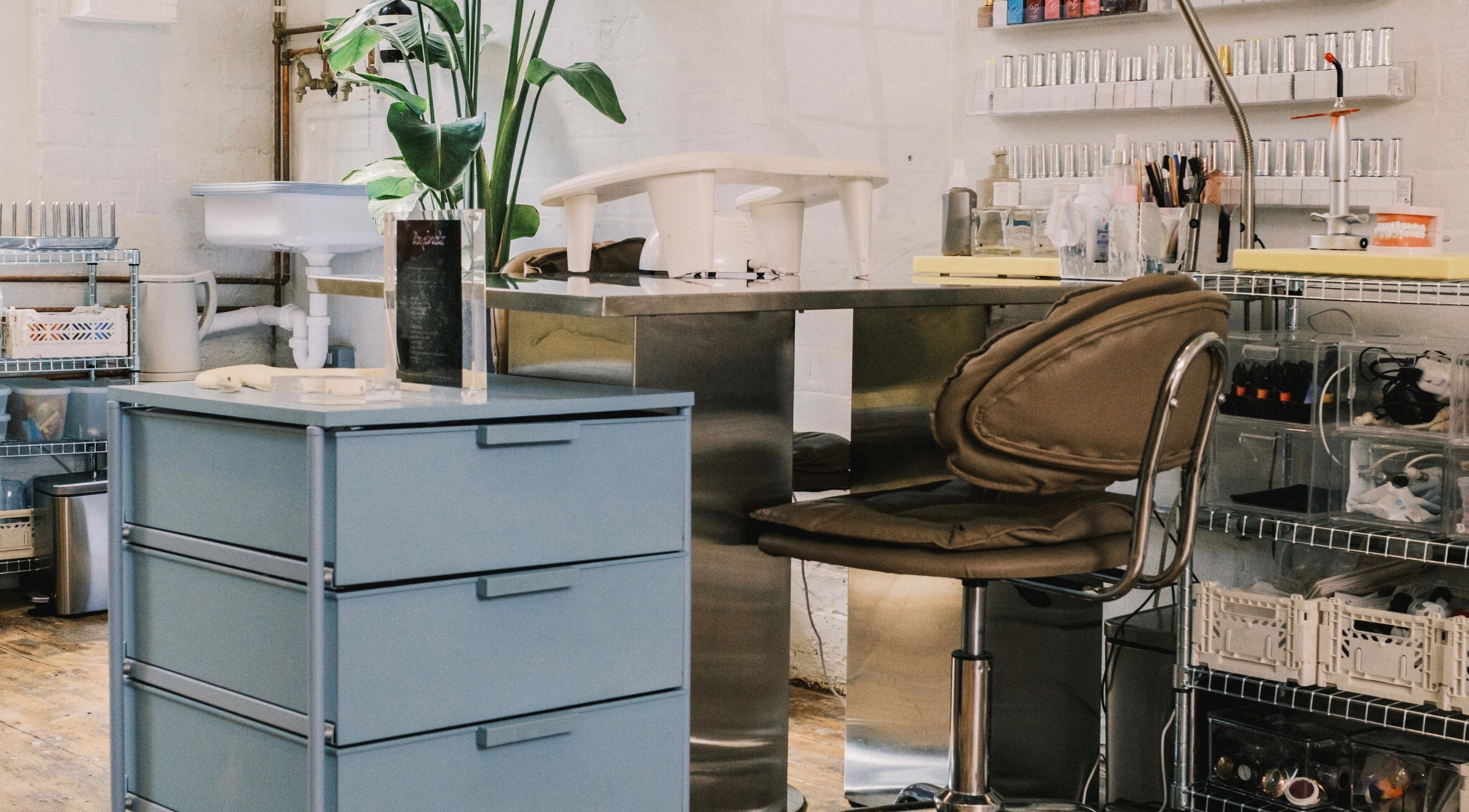 Modern nail studio at Milk Digits, London, England, GB with chic decor and organized workstations.